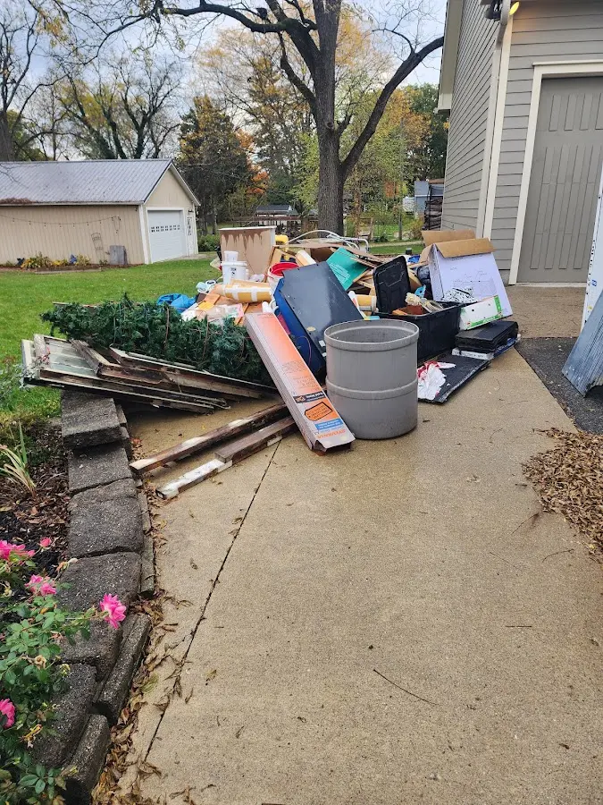 Dumpster being loaded with debris for Roofing Dumpster Rental in Oceanside